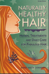 book cover with a drawing of a woman with red hair